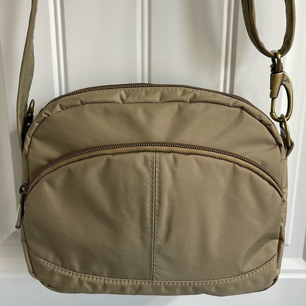 Tan Travel all weather crossbody.